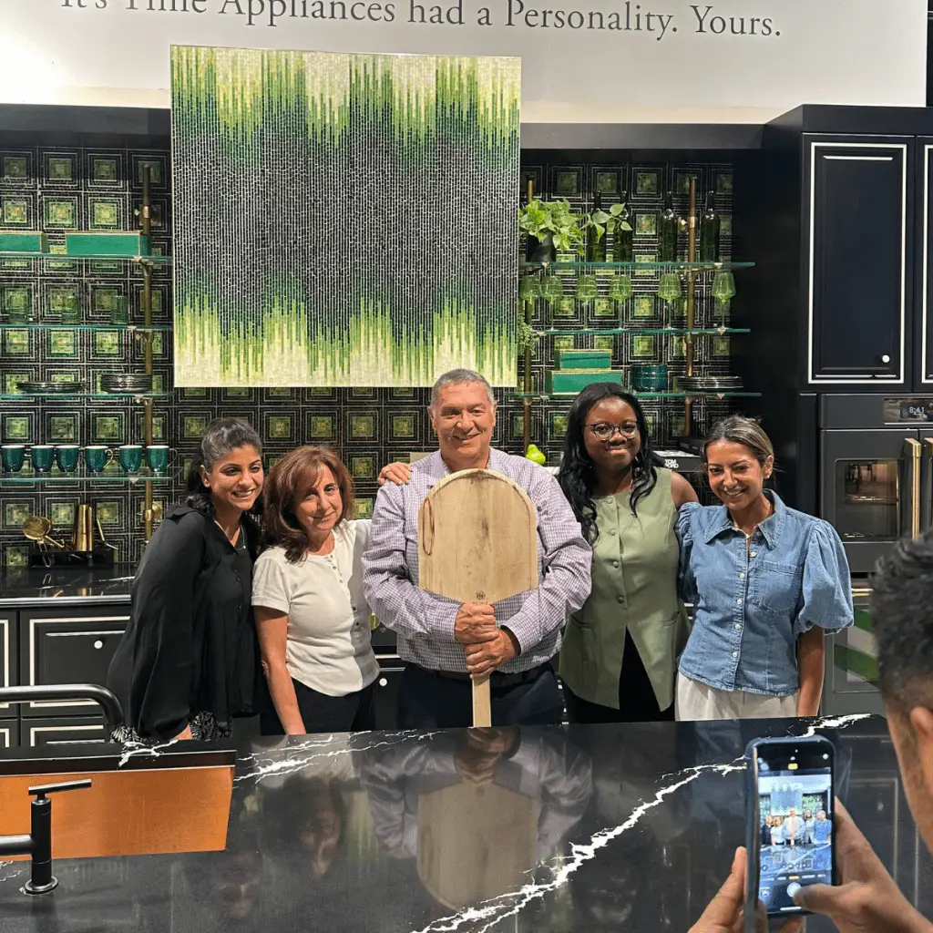 People having fun making pizzas in a corporate team building activity